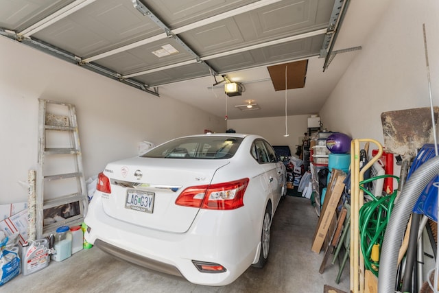 351 Wildwood Dr S Unit 5, Branson, MO 65616 - garage featuring a garage door opener