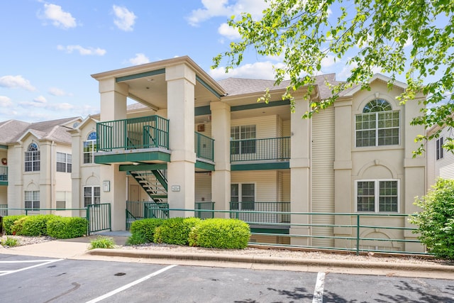 351 Wildwood Dr S Unit 5, Branson, MO 65616 - view of building exterior with uncovered parking and fence
