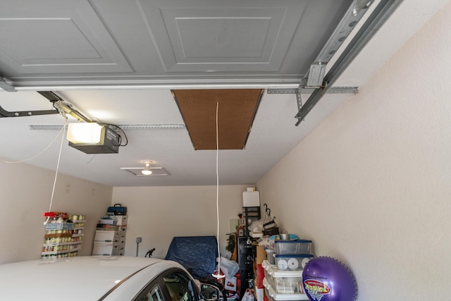 351 Wildwood Dr S Unit 5, Branson, MO 65616 - garage featuring a garage door opener