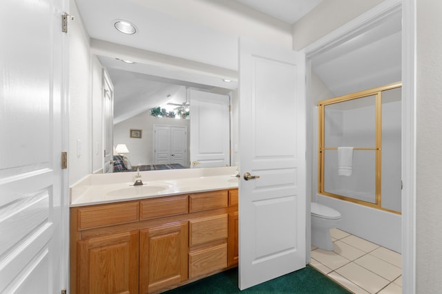 351 Wildwood Dr S Unit 5, Branson, MO 65616 - full bathroom featuring lofted ceiling, vanity, toilet, tile patterned flooring, and combined bath / shower with glass door