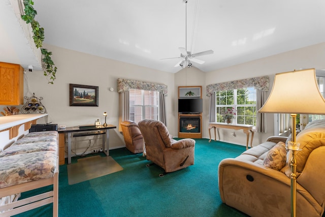 351 Wildwood Dr S Unit 5, Branson, MO 65616 - living area with carpet flooring, a ceiling fan, lofted ceiling, baseboards, and a glass covered fireplace