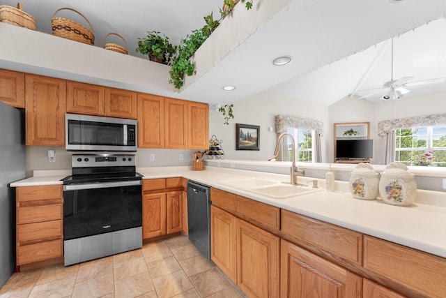351 Wildwood Dr S Unit 5, Branson, MO 65616 - kitchen with appliances with stainless steel finishes, a sink, light countertops, a ceiling fan, and lofted ceiling
