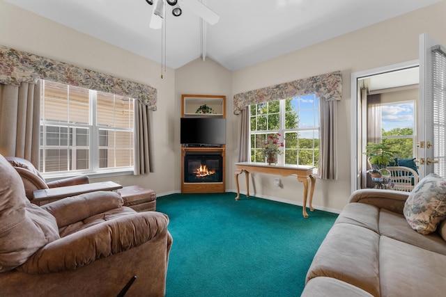 351 Wildwood Dr S Unit 5, Branson, MO 65616 - carpeted living area with lofted ceiling, baseboards, a glass covered fireplace, and ceiling fan