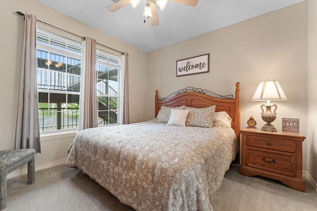 680 Emerald Pointe Dr Unit 6, Hollister, MO 65672 - bedroom with carpet flooring, baseboards, and a ceiling fan