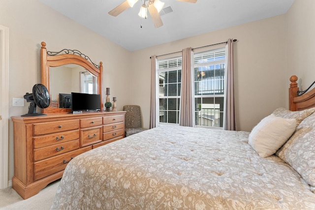 680 Emerald Pointe Dr Unit 6, Hollister, MO 65672 - bedroom featuring light carpet and a ceiling fan