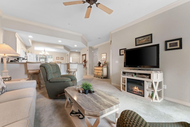 680 Emerald Pointe Dr Unit 6, Hollister, MO 65672 - living room with crown molding, a chandelier, a glass covered fireplace, a ceiling fan, and light carpet
