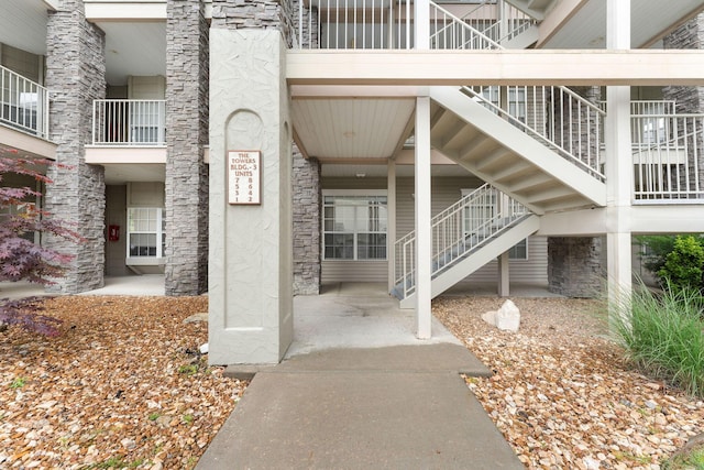 680 Emerald Pointe Dr Unit 6, Hollister, MO 65672 - view of exterior entry with stone siding and stucco siding