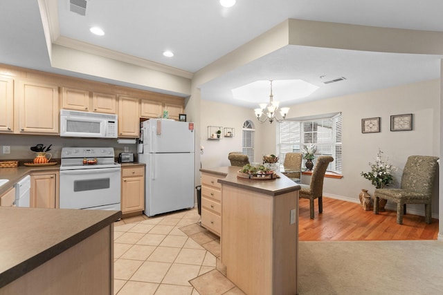 680 Emerald Pointe Dr Unit 6, Hollister, MO 65672 - kitchen with white appliances, light brown cabinetry, a raised ceiling, a chandelier, and recessed lighting