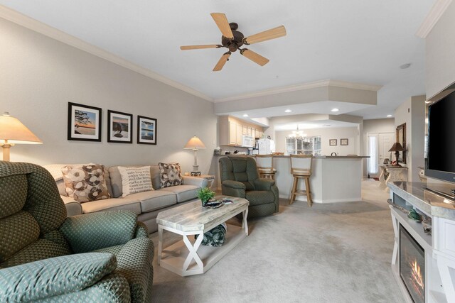 680 Emerald Pointe Dr Unit 6, Hollister, MO 65672 - living area with ornamental molding, light colored carpet, a ceiling fan, a chandelier, and a glass covered fireplace