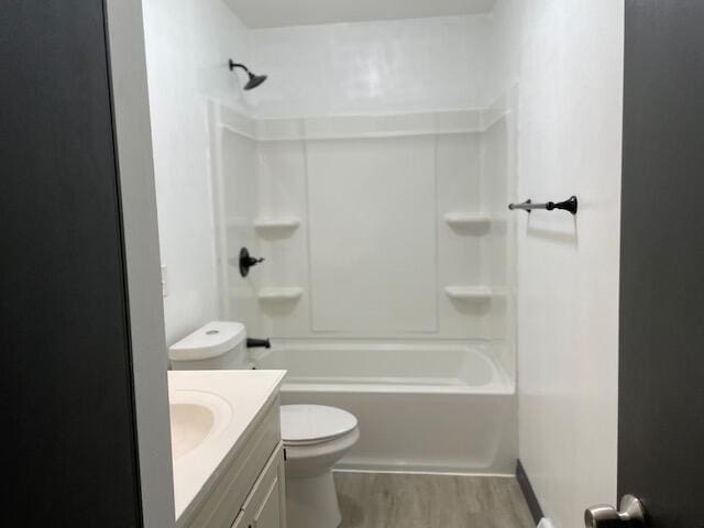 1627 W Lindberg St, Springfield, MO 65807 - full bathroom with wood finished floors, vanity, toilet, and  shower combination