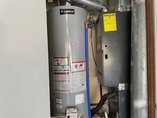 1627 W Lindberg St, Springfield, MO 65807 - utility room featuring gas water heater