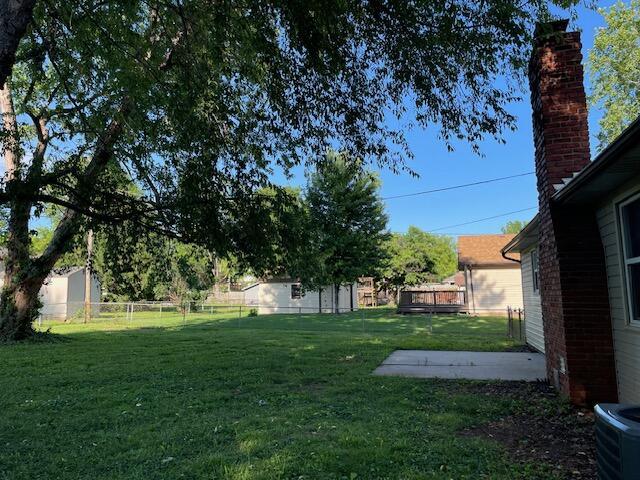 1627 W Lindberg St, Springfield, MO 65807 - view of yard with a patio area and central AC unit