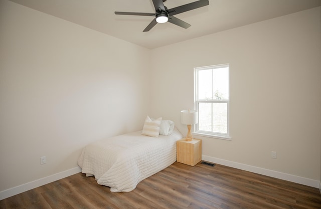 13320 E 1424th Rd, Stockton, MO 65785 - bedroom featuring baseboards, wood finished floors, and a ceiling fan