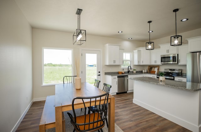 13320 E 1424th Rd, Stockton, MO 65785 - kitchen featuring stainless steel appliances, a center island, recessed lighting, white cabinetry, and dark wood finished floors