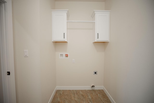 13320 E 1424th Rd, Stockton, MO 65785 - laundry area featuring electric dryer hookup, washer hookup, baseboards, and cabinet space