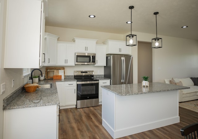 13320 E 1424th Rd, Stockton, MO 65785 - kitchen with stainless steel appliances, a sink, dark wood-style floors, white cabinetry, and recessed lighting