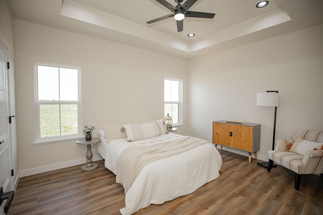 13320 E 1424th Rd, Stockton, MO 65785 - bedroom featuring a raised ceiling, baseboards, wood finished floors, recessed lighting, and ceiling fan