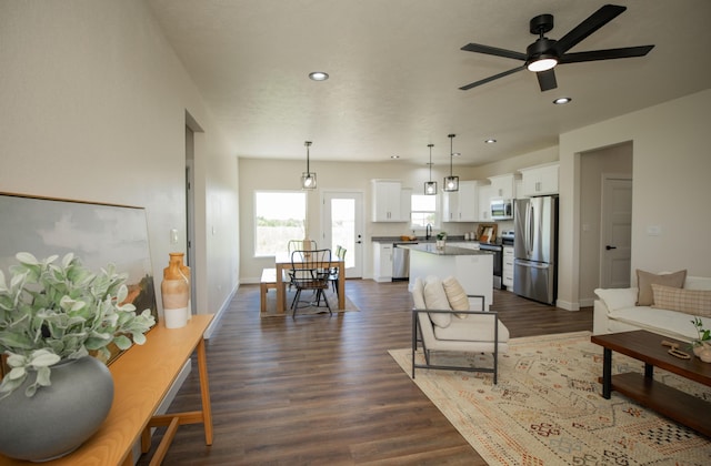 13320 E 1424th Rd, Stockton, MO 65785 - living room with recessed lighting, ceiling fan, dark wood-type flooring, and baseboards