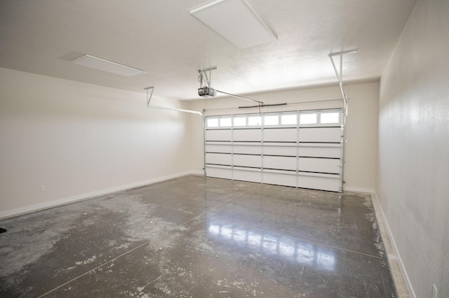 13320 E 1424th Rd, Stockton, MO 65785 - garage featuring a garage door opener and baseboards