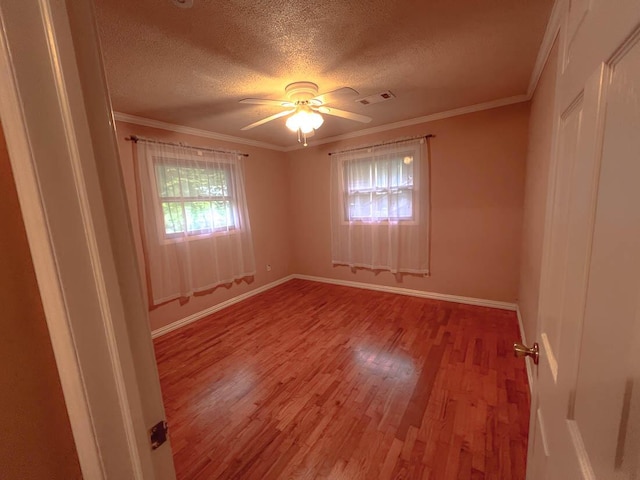 106 Blue Ridge Dr, Theodosia, MO 65761 - spare room featuring light wood-style floors, a textured ceiling, baseboards, a ceiling fan, and crown molding
