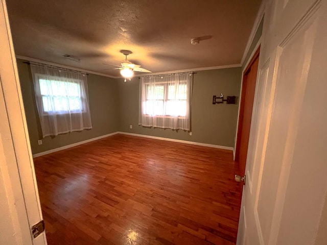 106 Blue Ridge Dr, Theodosia, MO 65761 - empty room with crown molding, healthy amount of natural light, wood finished floors, baseboards, and ceiling fan