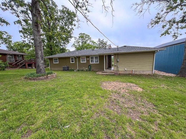 106 Blue Ridge Dr, Theodosia, MO 65761 - rear view of house featuring a yard and central AC