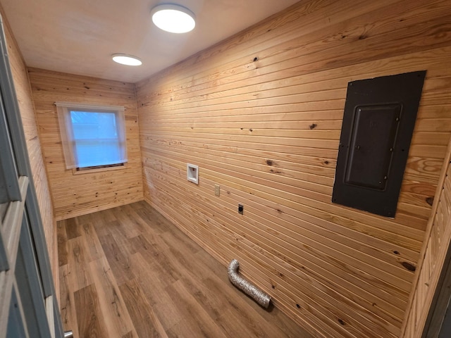 106 Blue Ridge Dr, Theodosia, MO 65761 - washroom featuring electric panel, wooden walls, and wood finished floors