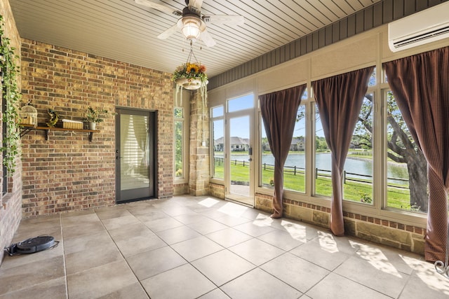 3260 W Rivulet Pass, Springfield, MO 65810 - unfurnished sunroom with an AC wall unit, brick wall, a water view, tile patterned floors, and a ceiling fan