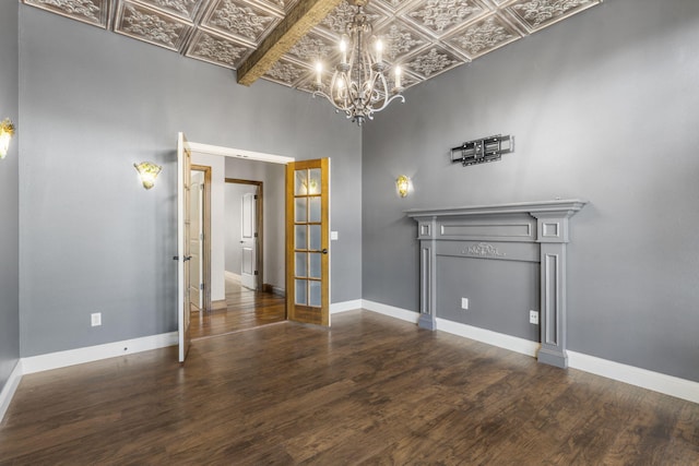3260 W Rivulet Pass, Springfield, MO 65810 - unfurnished room with an ornate ceiling, a chandelier, french doors, wood finished floors, and baseboards