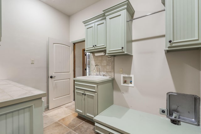 3260 W Rivulet Pass, Springfield, MO 65810 - washroom featuring hookup for an electric dryer, cabinet space, light tile patterned floors, and hookup for a washing machine