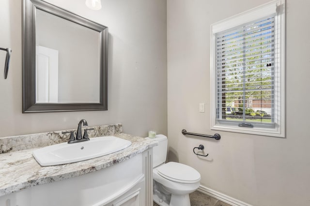 3260 W Rivulet Pass, Springfield, MO 65810 - bathroom featuring vanity, toilet, baseboards, and tile patterned flooring