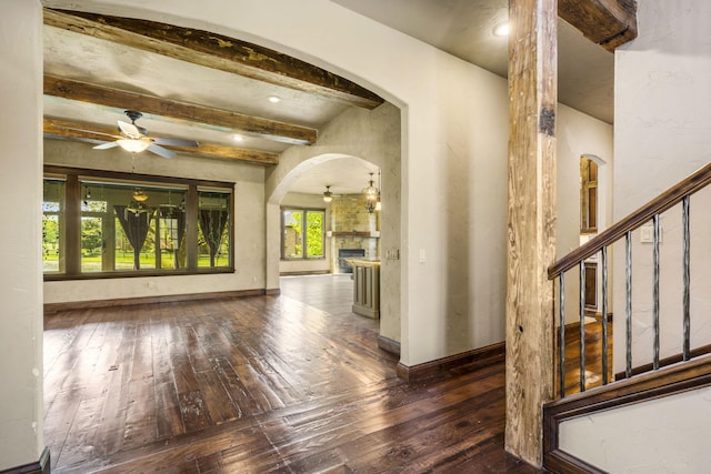 3260 W Rivulet Pass, Springfield, MO 65810 - hall with hardwood / wood-style flooring, arched walkways, beamed ceiling, stairway, and baseboards