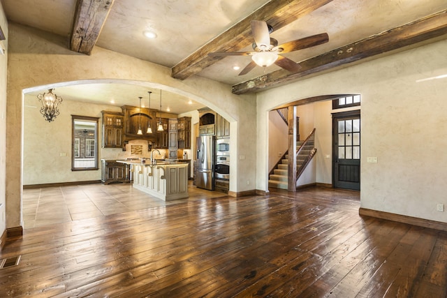 3260 W Rivulet Pass, Springfield, MO 65810 - unfurnished living room featuring arched walkways, dark wood-style flooring, baseboards, beam ceiling, and ceiling fan