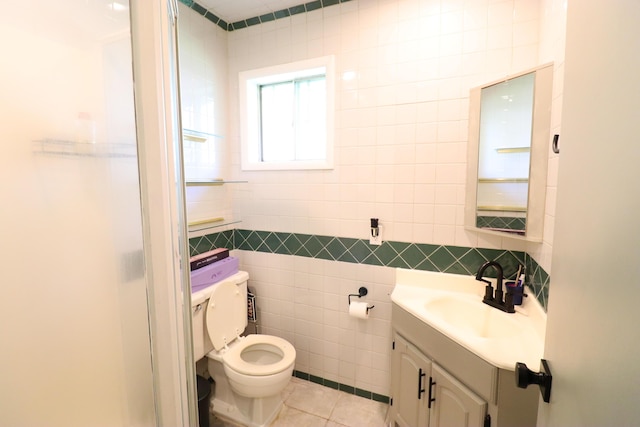 845 W Seminole St, Springfield, MO 65807 - bathroom featuring tile walls, toilet, vanity, and tile patterned flooring