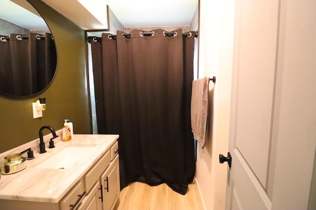 845 W Seminole St, Springfield, MO 65807 - full bath featuring vanity, wood finished floors, and a shower with shower curtain