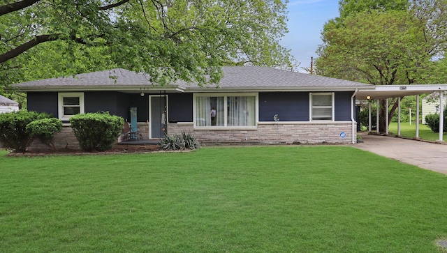 845 W Seminole St, Springfield, MO 65807 - view of front of house featuring driveway, a front lawn, a carport, stone siding, and a shingled roof