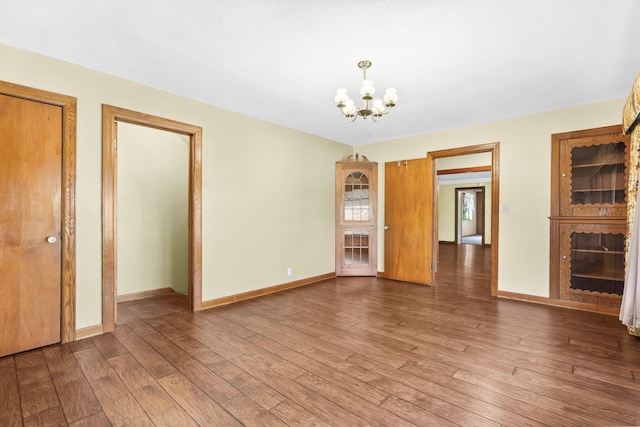 191 State Highway Y, Forsyth, MO 65653 - spare room featuring a chandelier, wood finished floors, and baseboards