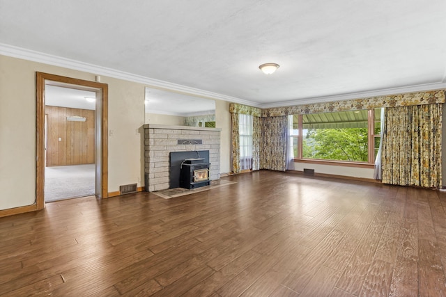 191 State Highway Y, Forsyth, MO 65653 - unfurnished living room featuring crown molding, wood finished floors, baseboards, and a wood stove