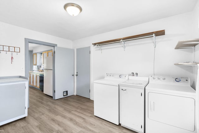191 State Highway Y, Forsyth, MO 65653 - laundry area featuring washer and dryer and light wood finished floors