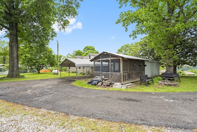 191 State Highway Y, Forsyth, MO 65653 - view of front of home featuring a sunroom, a carport, and driveway