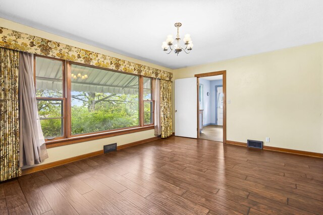 191 State Highway Y, Forsyth, MO 65653 - unfurnished dining area with a chandelier, baseboards, and wood finished floors