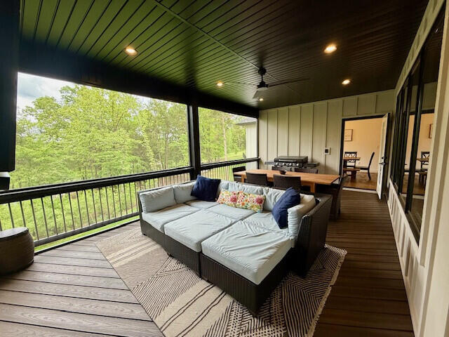 deck featuring an outdoor living space and ceiling fan