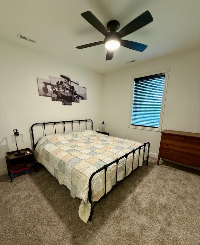 bedroom with carpet floors, baseboards, and a ceiling fan