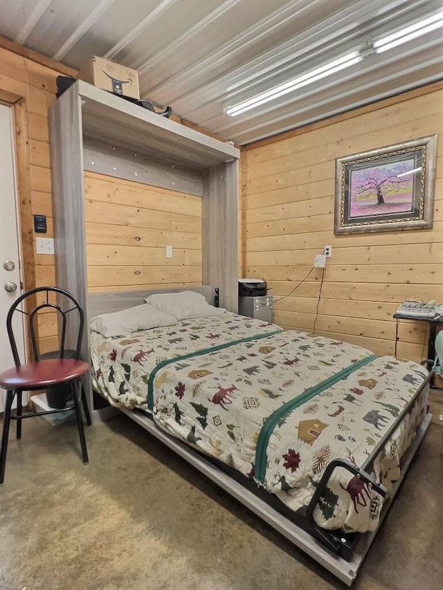 1424 Brown Rd, Van Buren, MO 63965 - bedroom featuring wooden walls and concrete flooring