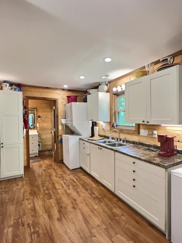 1424 Brown Rd, Van Buren, MO 63965 - kitchen with a sink, wood finished floors, washer / clothes dryer, white cabinets, and wood walls