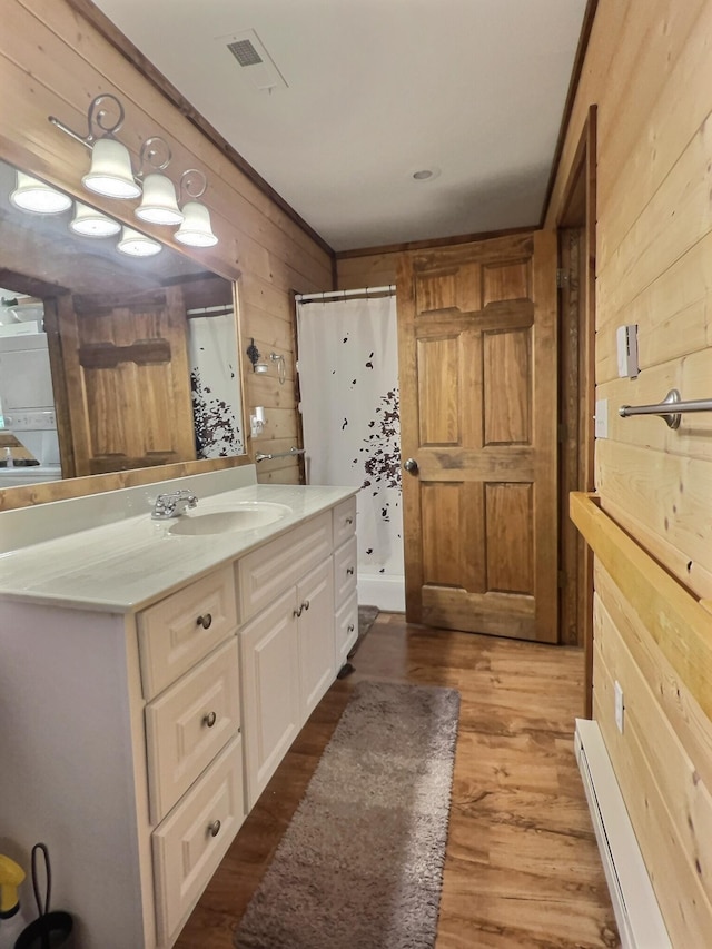 1424 Brown Rd, Van Buren, MO 63965 - bathroom with wood walls, wood finished floors, curtained shower, and vanity