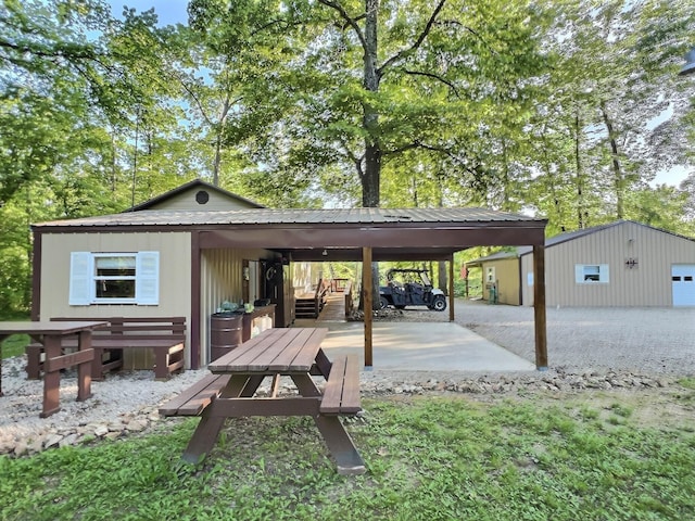 1424 Brown Rd, Van Buren, MO 63965 - view of patio featuring an outdoor structure and a carport