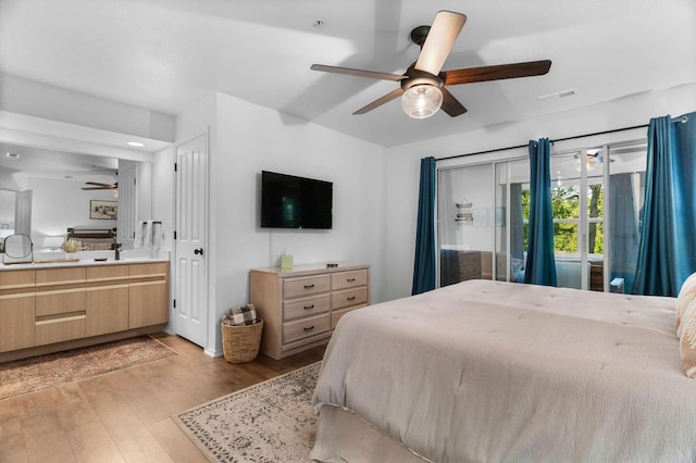77 Anglers Pointe Unit 4, Branson, MO 65616 - bedroom with light wood finished floors, vaulted ceiling, a ceiling fan, and connected bathroom