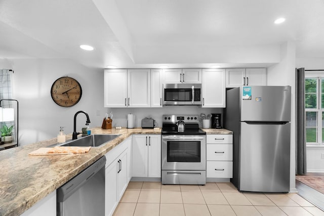 77 Anglers Pointe Unit 4, Branson, MO 65616 - kitchen with stainless steel appliances, a sink, light tile patterned floors, recessed lighting, and white cabinetry