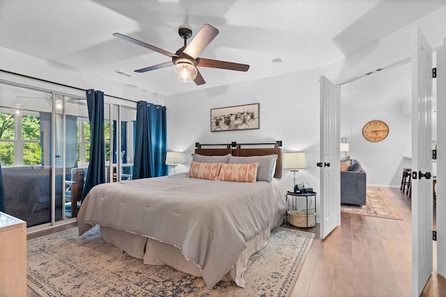 77 Anglers Pointe Unit 4, Branson, MO 65616 - bedroom featuring access to outside, hardwood / wood-style floors, ceiling fan, and baseboards